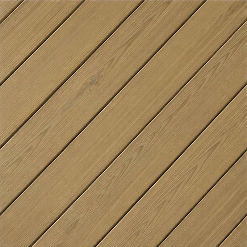 Close-up of light pressure-treated deck boards laid diagonally